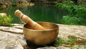 singing-bowl-placed-nature-with-river-background